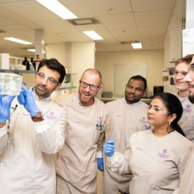 Dr Harendra Parekh (second from L) and research team looking at module